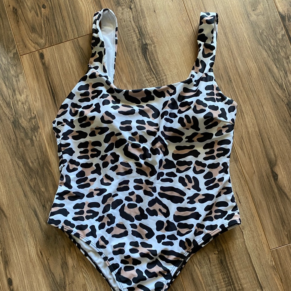 Cheetah print. Super cute!  One piece swimsuit, Large. Slightly cheeky.